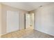 This quaint bedroom features tile flooring and a closet for storage at 4721 Via Renaldo, Las Vegas, NV 89103