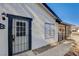 Side view of the home featuring a secure entry door and adjacent carport entrance at 4721 Via Renaldo, Las Vegas, NV 89103