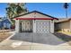 Charming single-story home with a two-car garage and decorative security gate at 4721 Via Renaldo, Las Vegas, NV 89103