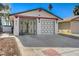 Attractive single-story home featuring a two-car garage with a black and white door design at 4721 Via Renaldo, Las Vegas, NV 89103