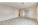 Spacious living room with tile floors, neutral walls, and a seamless flow into other areas at 4721 Via Renaldo, Las Vegas, NV 89103