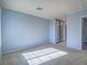 Light-blue walls and neutral carpeting in the bedroom at 4800 Nara Vista Way # 204, Las Vegas, NV 89103