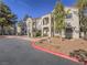 Two-story building with Spanish-style architecture and landscaping at 4800 Nara Vista Way # 204, Las Vegas, NV 89103