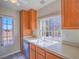 Kitchen features wood cabinets, a double sink, and a window at 4800 Nara Vista Way # 204, Las Vegas, NV 89103