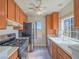 Bright kitchen with wood cabinets, stainless steel appliances, and a window view at 4800 Nara Vista Way # 204, Las Vegas, NV 89103