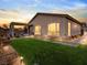 Landscaped backyard with lighting at sunset at 49 Strada Caruso, Henderson, NV 89011