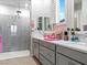 Elegant bathroom with double vanity and large walk-in shower at 49 Strada Caruso, Henderson, NV 89011