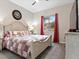 Quaint bedroom with a comfortable bed and red curtains at 49 Strada Caruso, Henderson, NV 89011