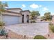 Contemporary home with a two-car garage and landscaped front yard at 49 Strada Caruso, Henderson, NV 89011