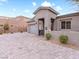 Modern home with a paved driveway and drought-tolerant landscaping at 49 Strada Caruso, Henderson, NV 89011