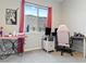 Bright home office with a large window and ergonomic chair at 49 Strada Caruso, Henderson, NV 89011