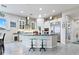 Spacious kitchen with an island, stainless steel appliances, and white cabinets at 49 Strada Caruso, Henderson, NV 89011