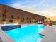 Inviting swimming pool with spa and seating area at 49 Strada Caruso, Henderson, NV 89011