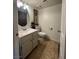 Cozy bathroom with tile floors, modern vanity, and decorative framed artwork at 526 Sellers Pl, Henderson, NV 89011