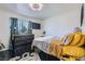 Stylish bedroom featuring a black accent wall, modern dresser, and comfortable bedding at 526 Sellers Pl, Henderson, NV 89011