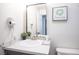 Close up of a bathroom featuring a vanity with stone countertop and framed mirror at 5515 Coley Ave, Las Vegas, NV 89146