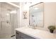 Bright bathroom featuring a glass shower and a vanity with a stone countertop at 5515 Coley Ave, Las Vegas, NV 89146