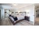 Bedroom featuring two beds with wood frames, wood floors, a closet, and bright lamps at 5515 Coley Ave, Las Vegas, NV 89146