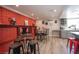 Lovely dining area with red brick wall, seating and stainless steel appliances nearby at 5515 Coley Ave, Las Vegas, NV 89146