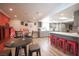 Inviting dining and kitchen area with bar seating and red brick wall at 5515 Coley Ave, Las Vegas, NV 89146