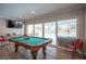 Game room boasting a pool table, large window overlooking the pool and bright interior at 5515 Coley Ave, Las Vegas, NV 89146