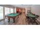 Expansive game room with pool table, card table, and natural light overlooking pool at 5515 Coley Ave, Las Vegas, NV 89146