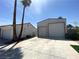 Two garages with roll-up doors and wide concrete driveway at 5515 Coley Ave, Las Vegas, NV 89146