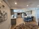 Modern kitchen features light grey cabinets, quartz countertops, and light oak flooring at 5515 Coley Ave, Las Vegas, NV 89146