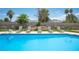 Backyard pool area with lounge chairs and a pristine pool perfect for relaxation and outdoor enjoyment at 5515 Coley Ave, Las Vegas, NV 89146