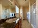 Main bathroom with shower, toilet, vanity, and stacked washer/dryer at 569 Sellers Pl # 569, Henderson, NV 89011