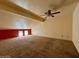 Spacious loft area with carpeted floors and a ceiling fan at 569 Sellers Pl # 569, Henderson, NV 89011