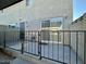 Private patio with a sliding glass door and metal fence at 569 Sellers Pl # 569, Henderson, NV 89011