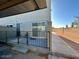 Private patio area with sliding glass doors and a metal fence at 569 Sellers Pl # 569, Henderson, NV 89011