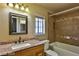 Bathroom with granite vanity, shower/tub combo, and tile flooring at 722 Barrie Ct, Henderson, NV 89002