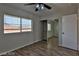 Bedroom with mirrored closet doors and a ceiling fan at 722 Barrie Ct, Henderson, NV 89002