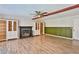 Living room with wood floors, fireplace, and ceiling fan at 722 Barrie Ct, Henderson, NV 89002