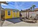 Bright yellow storage shed in the backyard at 722 Barrie Ct, Henderson, NV 89002