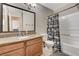 Bathroom with granite vanity and a tub shower at 7300 Pirates Cove Rd # 2013, Las Vegas, NV 89145