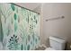 Simple bathroom with shower/tub and leafy shower curtain at 7300 Pirates Cove Rd # 2013, Las Vegas, NV 89145