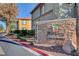 Mariposa Condominiums entrance featuring manicured landscaping and clear signage at 7300 Pirates Cove Rd # 2013, Las Vegas, NV 89145