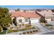 Single story house with a terracotta roof and landscaped yard at 7436 Wagonwheel Ranch Way, Las Vegas, NV 89113