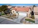 Single-story home with a terracotta roof and landscaped yard at 7436 Wagonwheel Ranch Way, Las Vegas, NV 89113