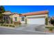 House exterior with landscaped yard and attached garage at 7436 Wagonwheel Ranch Way, Las Vegas, NV 89113