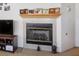 Living room fireplace with a tile surround and mantel at 7436 Wagonwheel Ranch Way, Las Vegas, NV 89113