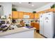 Bright kitchen with wood cabinets and ample counter space at 7436 Wagonwheel Ranch Way, Las Vegas, NV 89113