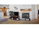 Cozy living room featuring a fireplace and built-in shelving at 7436 Wagonwheel Ranch Way, Las Vegas, NV 89113