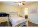 Bedroom featuring a bed with built-in storage, wood floors, and access to an en-suite bathroom at 7611 Redcloud Peak St, Las Vegas, NV 89166