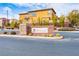 Well-maintained neighborhood entrance sign with stone accents and desert landscaping at 7611 Redcloud Peak St, Las Vegas, NV 89166