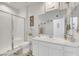 Clean bathroom with a walk-in shower and modern vanity at 7747 Harthill Park Ave, Las Vegas, NV 89113