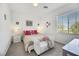 Bright bedroom with plush bedding and window seating at 7747 Harthill Park Ave, Las Vegas, NV 89113